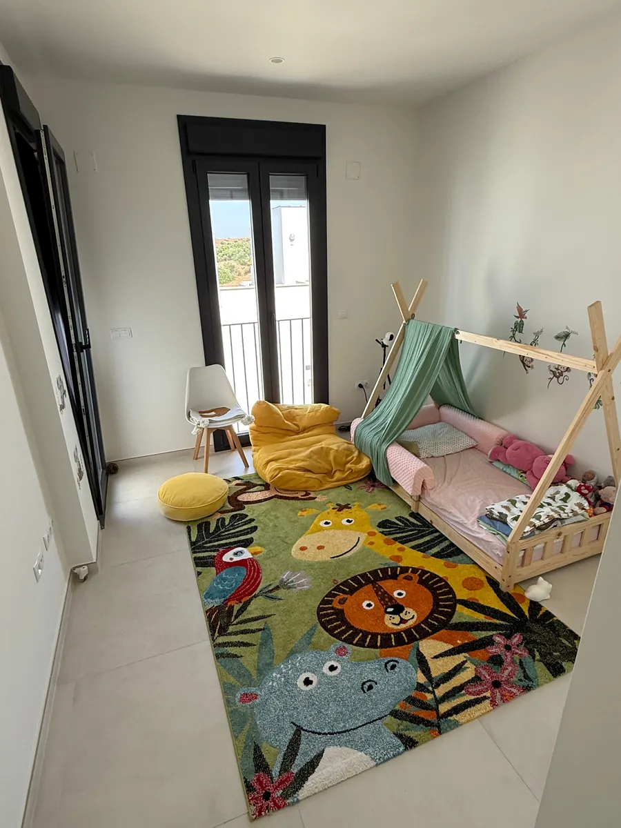 Children's room with a house-style bed in the Tarifa townhouse