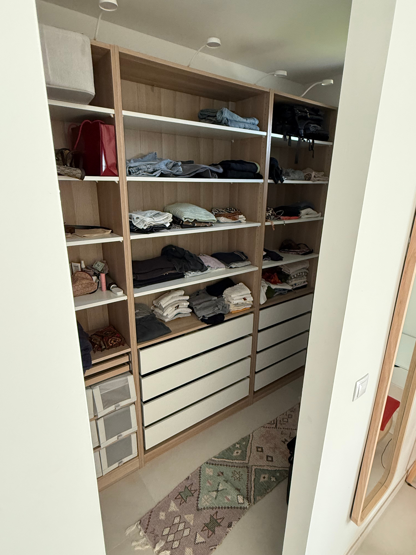 Walk-in closet with built-in organizers in Tarifa modern rental property