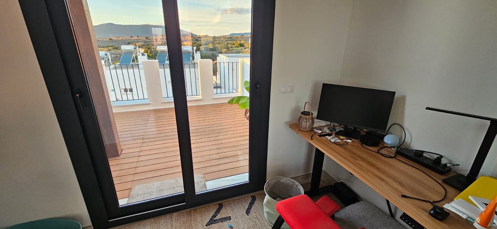 Dedicated remote work desk with ocean view in Tarifa townhouse for digital nomads