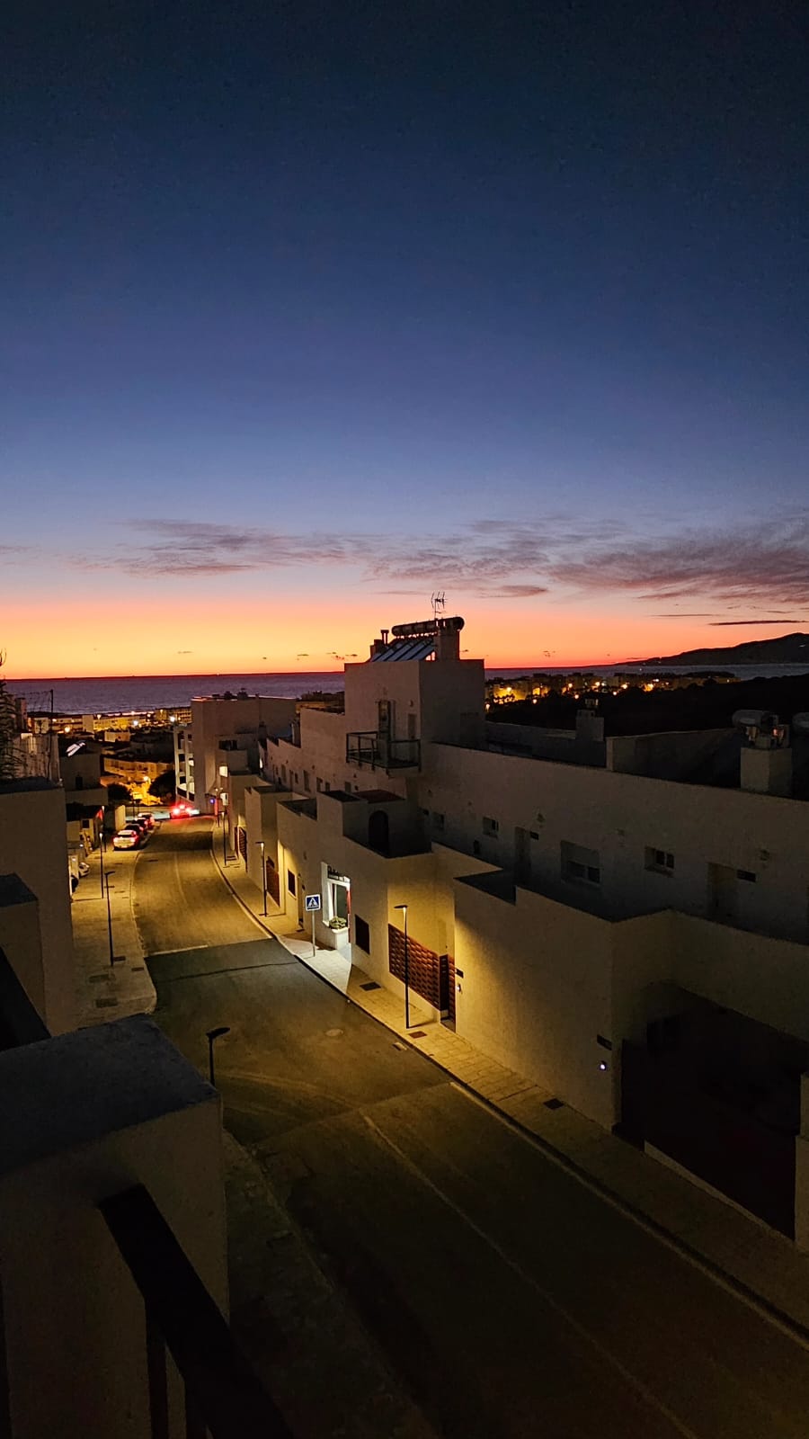 Golden sunset over the Strait of Gibraltar seen from Tarifa townhouse terrace